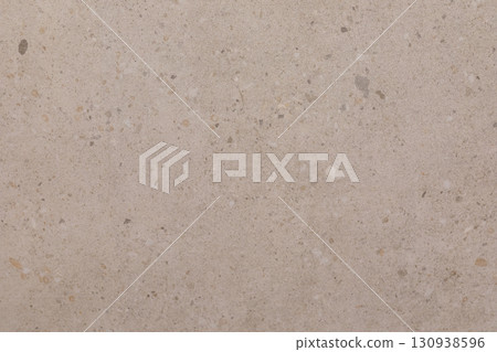 Light beige textured surface showcasing natural variations and small stones in a contemporary Light beige textured surface showcasing natural variations and small stones in a contemporary 130938596