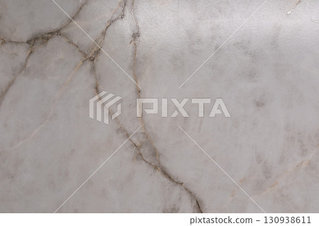 Elegant marble surface showcasing intricate veining patterns in soft gray tones Elegant marble surface showcasing intricate veining patterns in soft gray tones 130938611