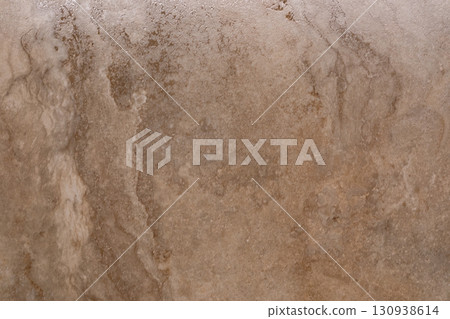 Natural textured stone surface with subtle patterns and earthy tones for modern interior design 130938614