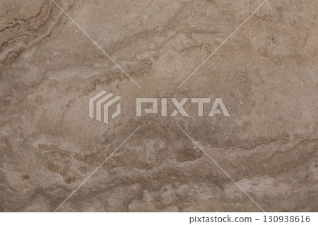 Natural stone surface with subtle patterns and earthy tones found in a modern interior design Natural stone surface with subtle patterns and earthy tones found in a modern interior design 130938616