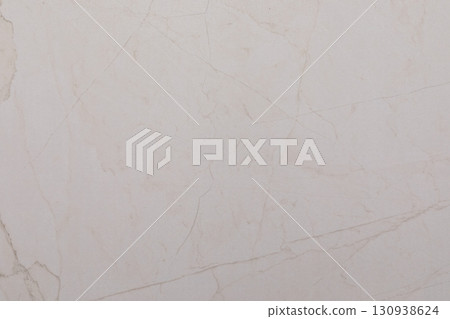 Light-colored marble surface with subtle veining and texture perfect for interior design 130938624