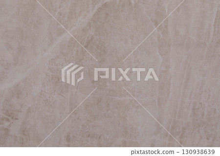 Detailed close-up of light-colored stone surface showcasing natural texture and patterns in a modern Detailed close-up of light-colored stone surface showcasing natural texture and patterns in a modern 130938639