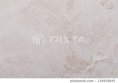 Light beige marble surface showcasing natural patterns and textures for interior design projects and Light beige marble surface showcasing natural patterns and textures for interior design projects and 130938645