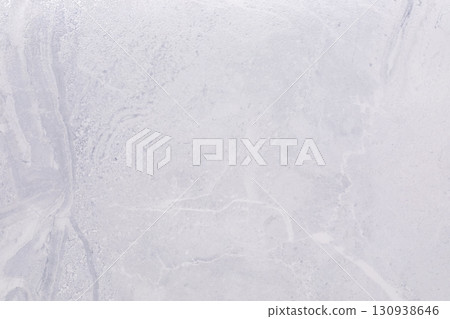 Light gray concrete surface with subtle texture and natural patterns for construction or design 130938646