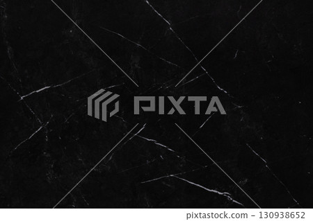 Dark marble surface with contrasting white veins creates an elegant and sophisticated background for Dark marble surface with contrasting white veins creates an elegant and sophisticated background for 130938652