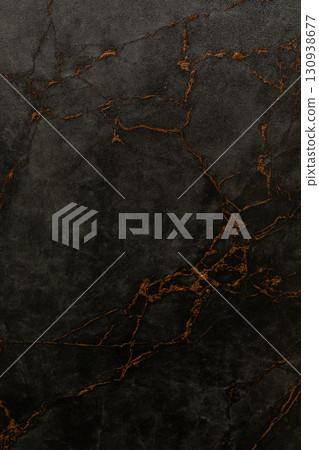 Dark marble surface with orange veins showcasing natural patterns for elegant design and decor 130938677