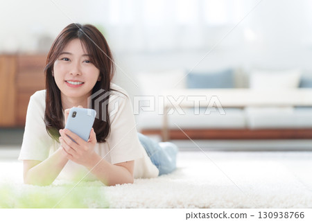 A young woman using a smartphone A young woman using a smartphone 130938766