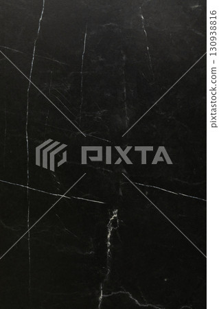 Dark and elegant marble surface with white veining showing texture and contrast in a modern setting 130938816