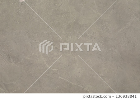 Textured surface of natural stone displaying subtle patterns and colors in a neutral palette Textured surface of natural stone displaying subtle patterns and colors in a neutral palette 130938841