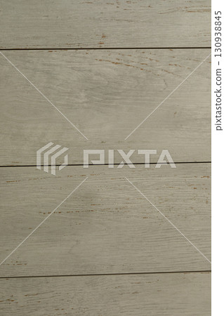 Light gray wooden planks arranged in a clean, modern pattern ideal for various interior design 130938845