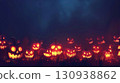 A group of Halloween pumpkin lanterns glowing at night 130938862
