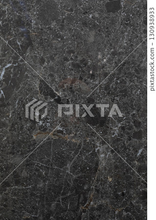 Dark marble texture with intricate veining patterns showcasing elegance and natural beauty in a 130938933
