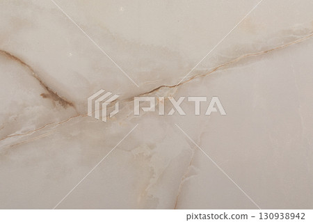 Beautiful light beige marble surface with natural patterns and veins, suitable for elegant interiors 130938942