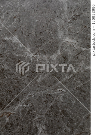 Natural gray marble surface showcasing intricate patterns and textures found in elegant interior 130938996