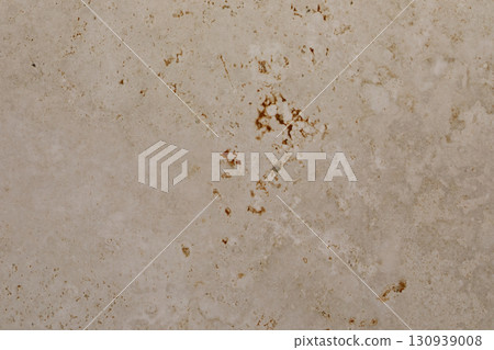 Textured surface shows natural stone pattern with earthy tones in a modern interior design setting 130939008