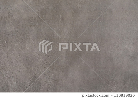 Concrete wall texture with subtle color variations and a smooth finish in natural light Concrete wall texture with subtle color variations and a smooth finish in natural light 130939020