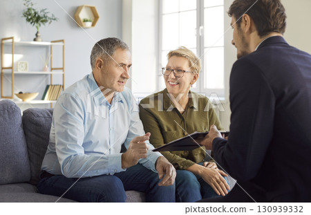 Senior couple, family buyers or sellers visiting realtor, agent, discussing insurance agreement Senior couple, family buyers or sellers visiting realtor, agent, discussing insurance agreement 130939332