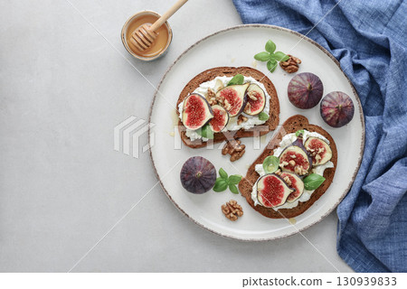 Sandwiches with figs, cream cheese, basil and honey Sandwiches with figs, cream cheese, basil and honey 130939833
