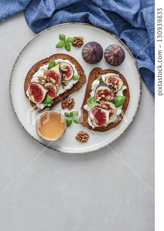Sandwiches with figs, cream cheese, basil and honey Sandwiches with figs, cream cheese, basil and honey 130939835