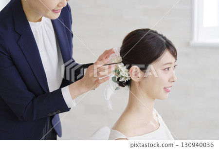 Women's wedding hair styling 130940036