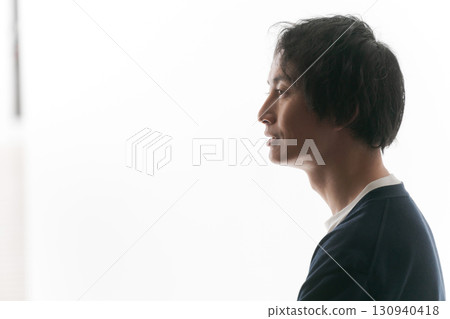 Silhouette of a worried man Silhouette of a worried man 130940418