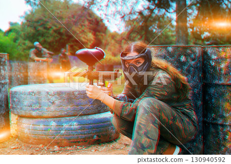 Portrait of team of adult people playing on paintball battlefield zone 130940592