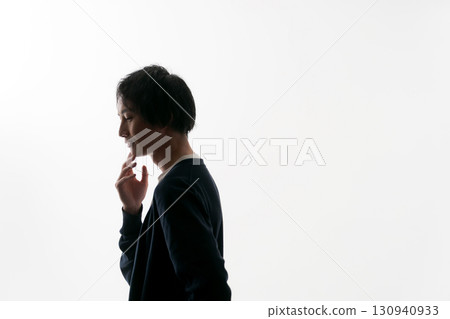 Silhouette of a worried man 130940933