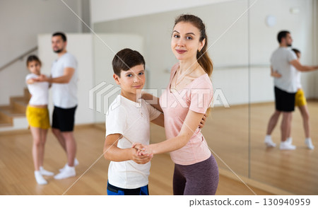 Family practicing active dance in pairs Family practicing active dance in pairs 130940959