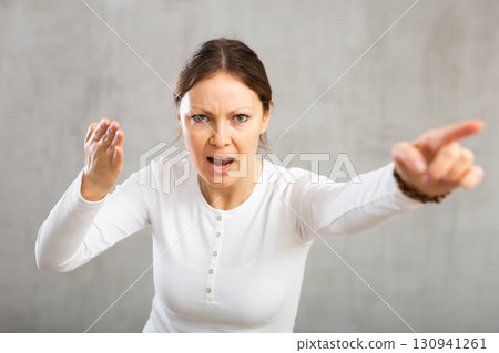 Indignant adult woman girl gesturing in studio 130941261