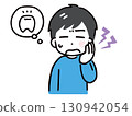 A young man in casual clothes with a toothache (upper body, front view) 130942054