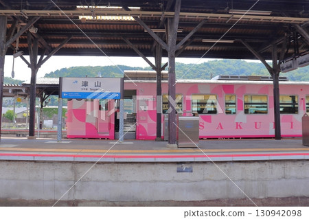 Tsuyama Line Scenic Train SAKUBISAKURAKU and Station Sign (Tsuyama Station) Tsuyama Line Scenic Train SAKUBISAKURAKU and Station Sign (Tsuyama Station) 130942098