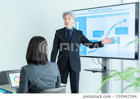 Middle-aged office worker meeting 130942564