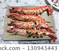 Grilled tiger prawns with salt 130943443