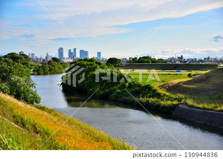 Kasugai City, Aichi Prefecture: Nagoya Station skyscrapers seen from the confluence of the Hatta River and Shonai River 130944836