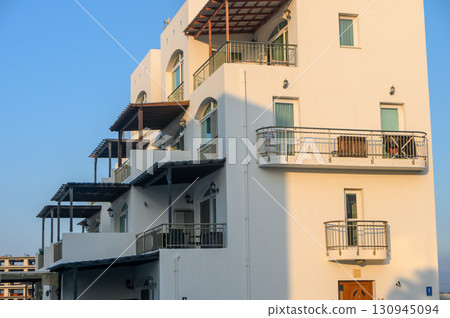 Stunning modern architecture of a coastal retreat bathed in golden afternoon light Stunning modern architecture of a coastal retreat bathed in golden afternoon light 130945094