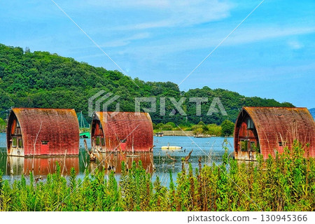 Buildings submerged in water due to flooding Buildings submerged in water due to flooding 130945366