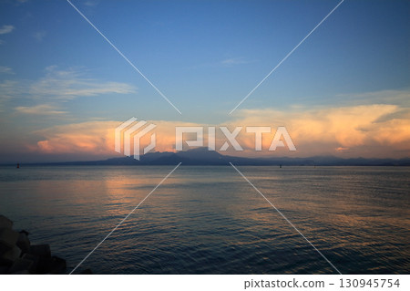 An anvil cloud formed along the mountains of Tottori Prefecture on a summer evening. An anvil cloud formed along the mountains of Tottori Prefecture on a summer evening. 130945754