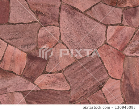 Background image 2 of a bright reddish-brown irregularly shaped paving stone surface 130946095