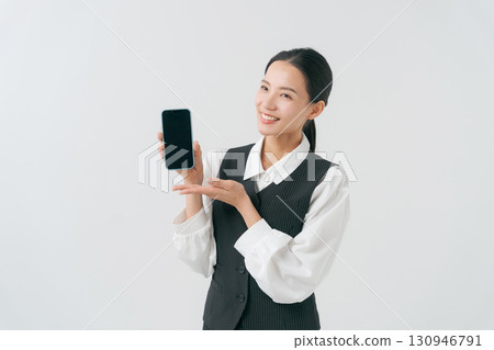 Female staff with smartphone 130946791