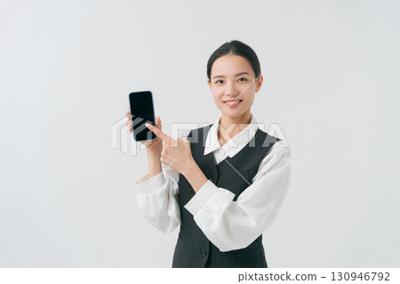 Female staff with smartphone Female staff with smartphone 130946792