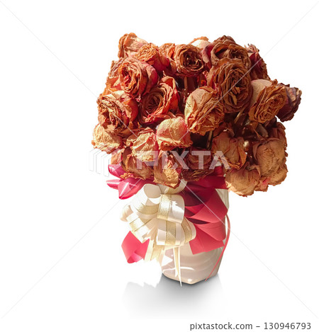 A bouquet of dried roses, brown and red, in a vase, tied with red and white ribbons, on a white background, love, valentine, decor, fashion, copy space A bouquet of dried roses, brown and red, in a vase, tied with red and white ribbons, on a white background, love, valentine, decor, fashion, copy space 130946793