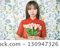 Woman with a bouquet 130947326