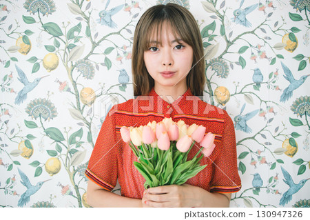 Woman with a bouquet 130947326
