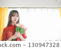 Woman with a bouquet 130947328