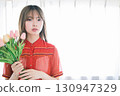 Woman with a bouquet 130947329