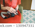 A woman taking a picture 130947331