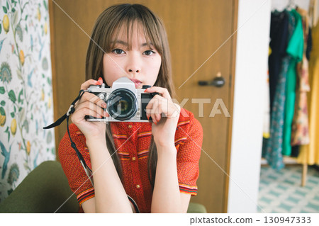 A woman taking a picture A woman taking a picture 130947333