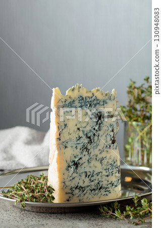 Gorgonzola and thyme on a gray stone table. Gorgonzola and thyme on a gray stone table. 130948083