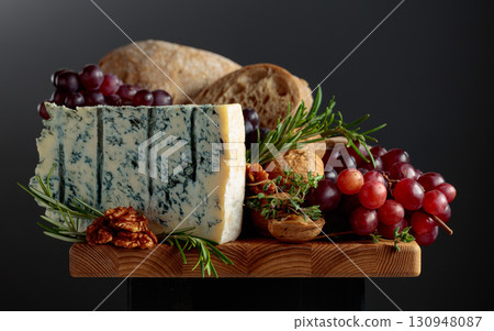 Gorgonzola cheese with ciabatta, walnuts, grapes, and aromatic herbs. Gorgonzola cheese with ciabatta, walnuts, grapes, and aromatic herbs. 130948087