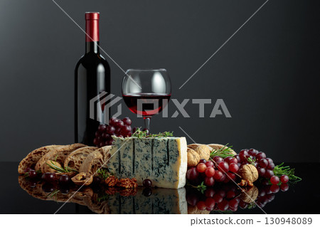 Gorgonzola cheese with ciabatta, walnuts, grapes, and red wine. Gorgonzola cheese with ciabatta, walnuts, grapes, and red wine. 130948089